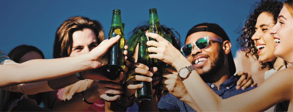 group of friends with glass bottles