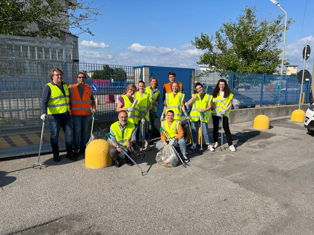 O-I employees gather to clean up the area around our Orrigio, Italy, plant and offices in honor of World Environment Day.