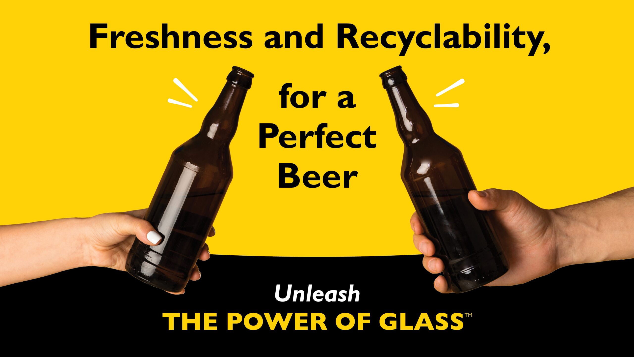 Glass beer bottles toasting